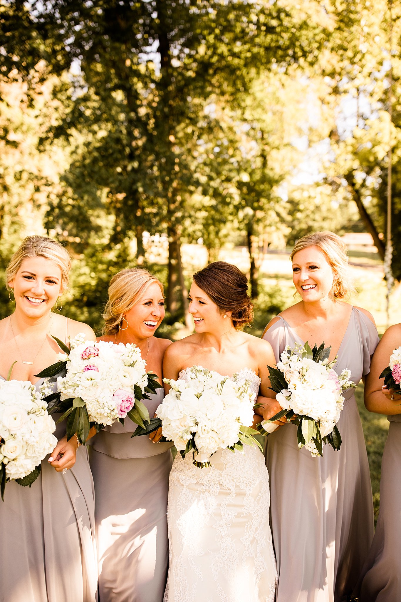 Stone House of St. Charles Wedding, Bride and bridesmaids wearing gray bridesmaid dresses