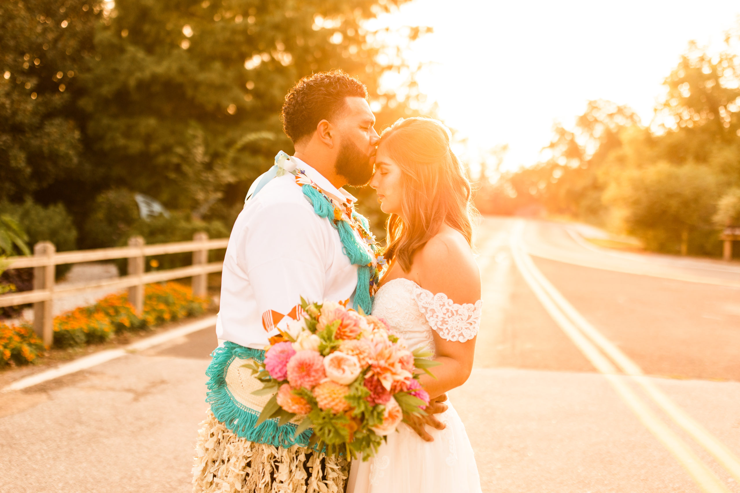 Portrait of a bride and groom dressed in traditional Pacific Islander wedding clothing
